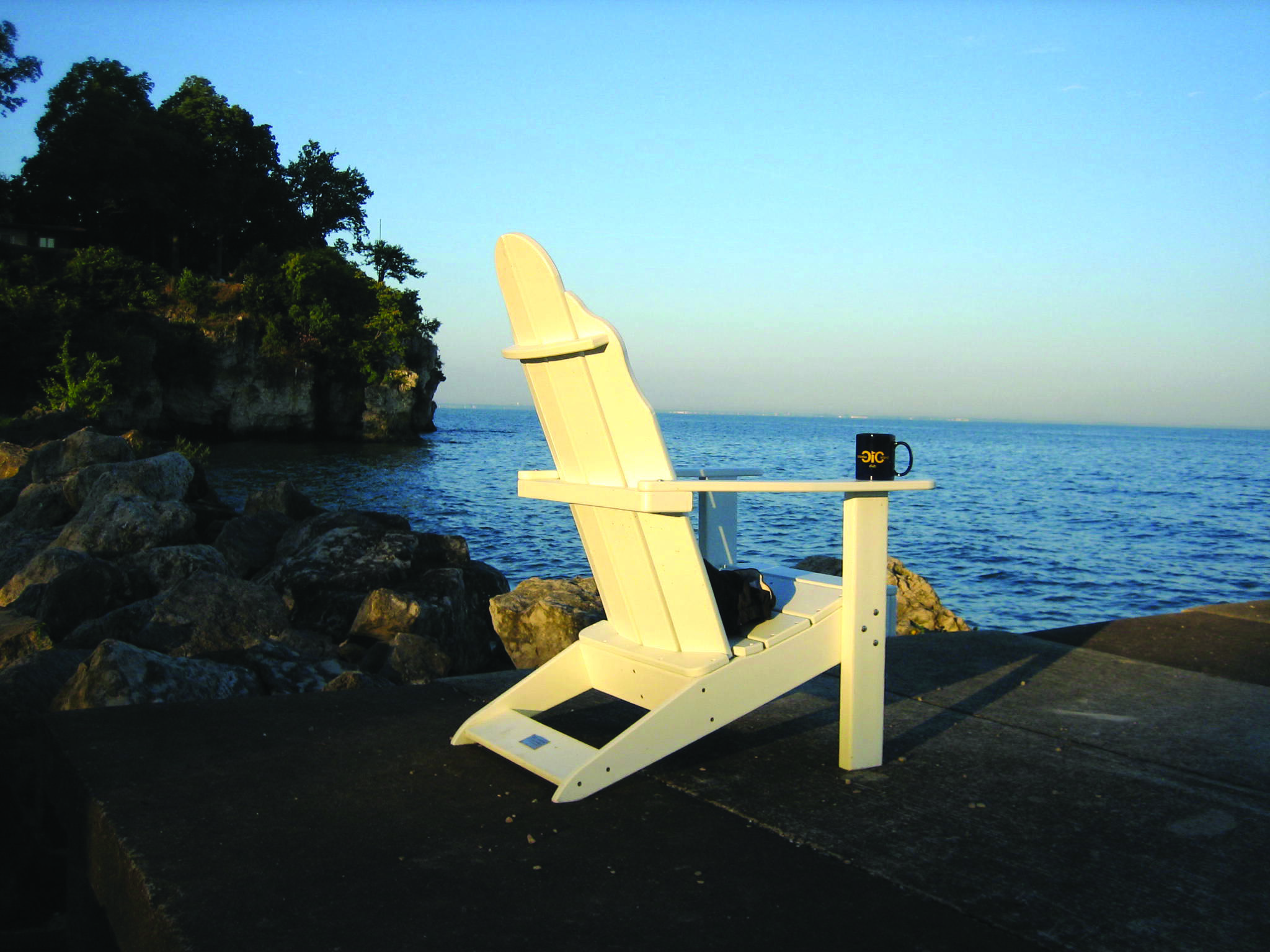 chair and coffee along the shore of lake erie on catawba island